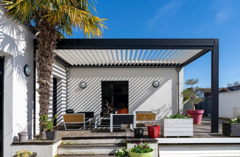 Modern aluminum pergola installed by Coconut Grove Landscape & Design in Jacksonville Beach, FL